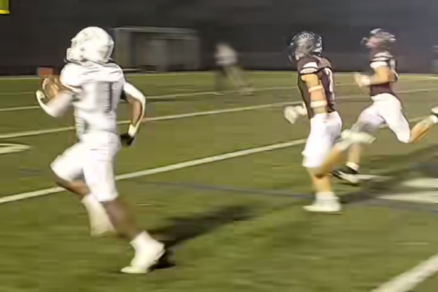 Billerica Memorial High School (BMHS) senior and football team running back, Judd Dorival runs the ball down the field making the second touchdown for BMHS in the first five minutes of the game.