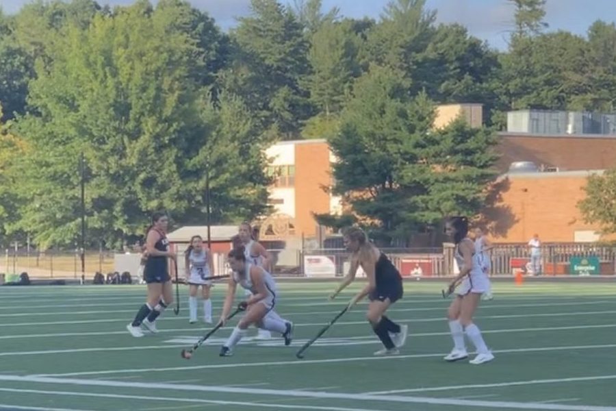 WA weaves between North Andover players, hoping to drive the ball to their net.