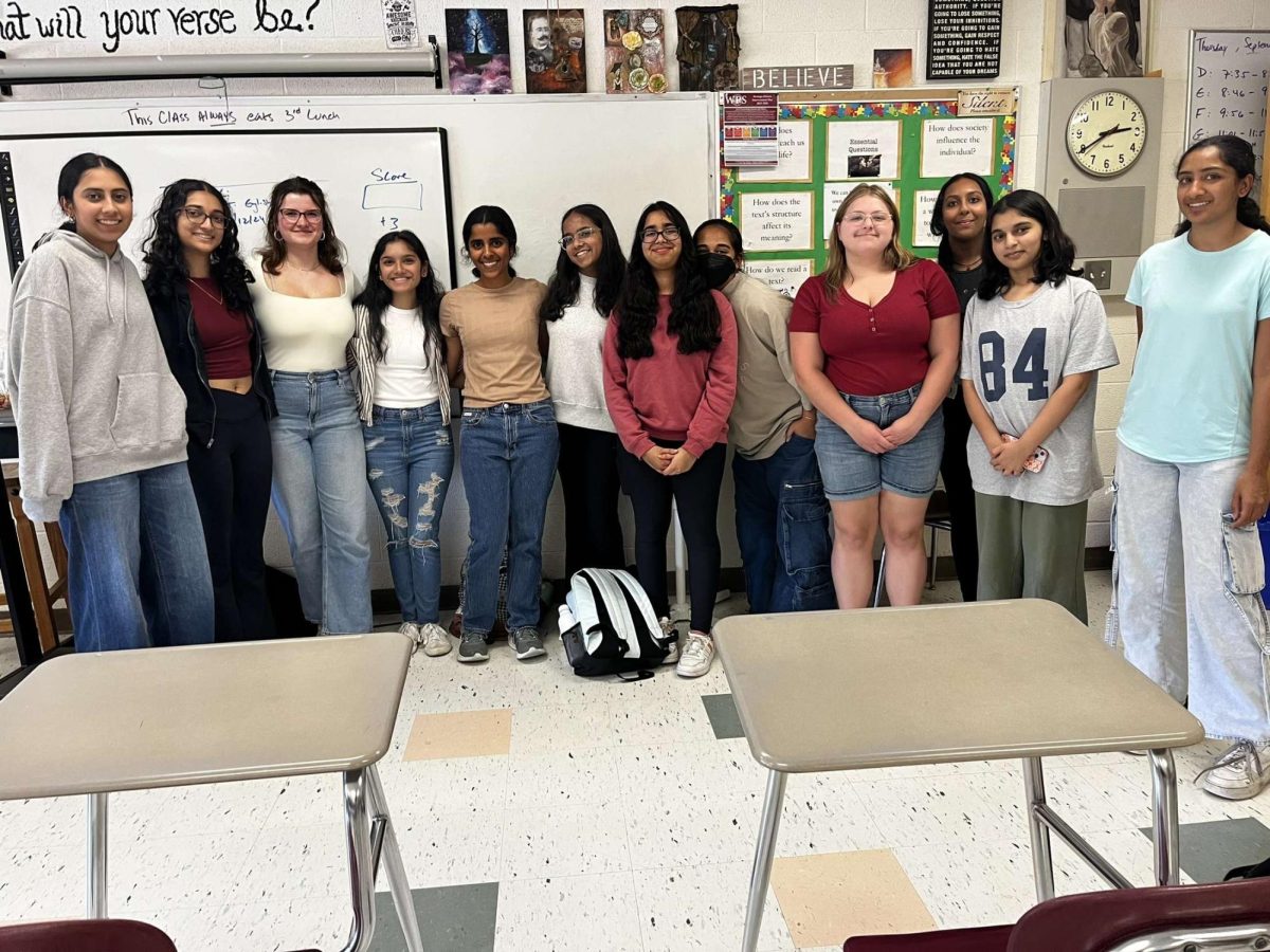 Club members smile for a photo at the first meeting.