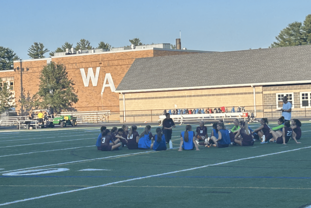 The team huddles after the first half comes to a close. 