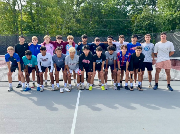 This year's Boys' Varsity Soccer team playing soccer tennis. 