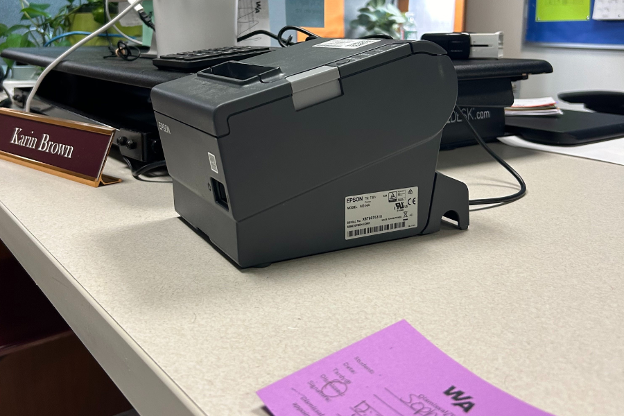 An image of the tardy pass machine at the front desk. 