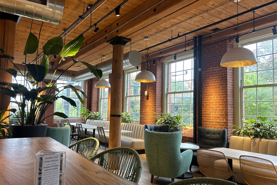 Tall brick accents with earth tone furniture help to amplify the atmosphere of the Dragonfly Cafe.