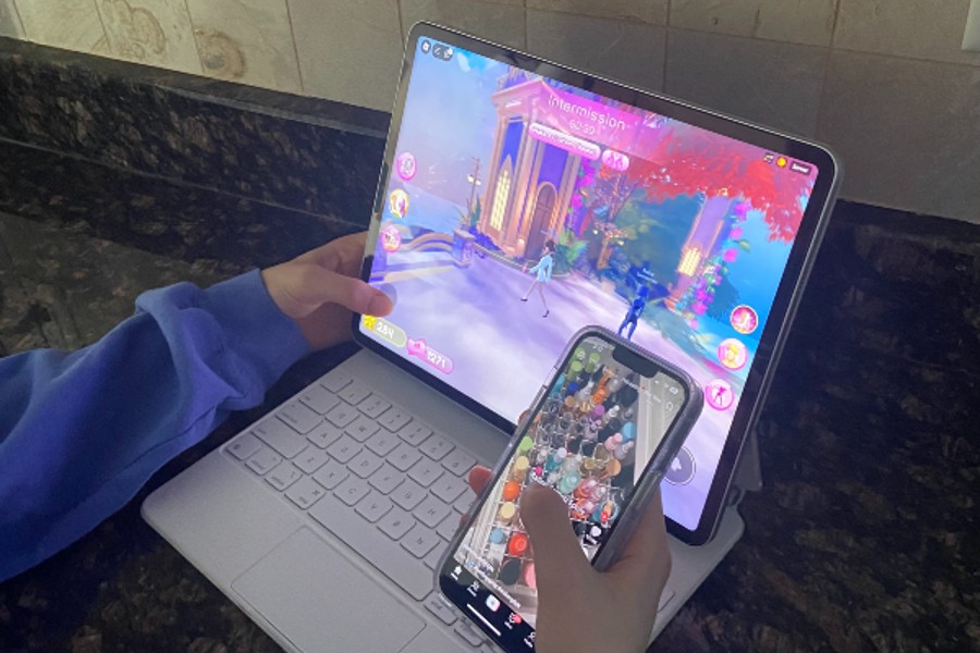 The Roblox game 'Dress to Impress' and TikTok (pictured from left to right) are popular among kids.  