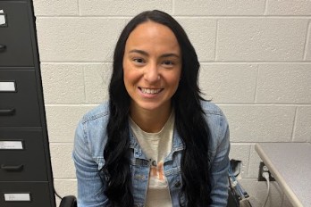 Coyle poses for a picture in her office. 