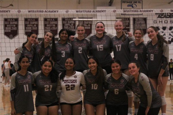 The team poses for a photo after winning the game.