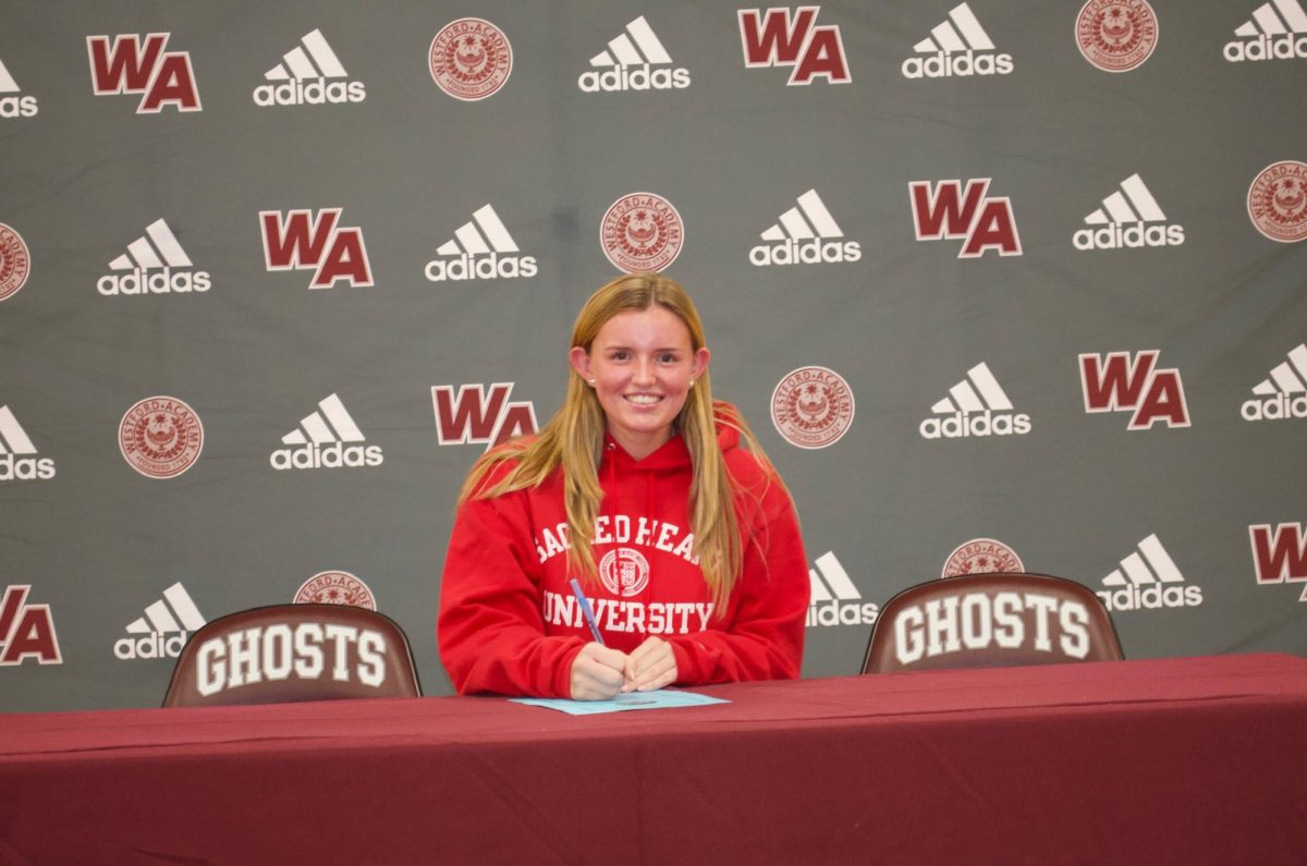 Bellomy smiles for a picture on her signing day.