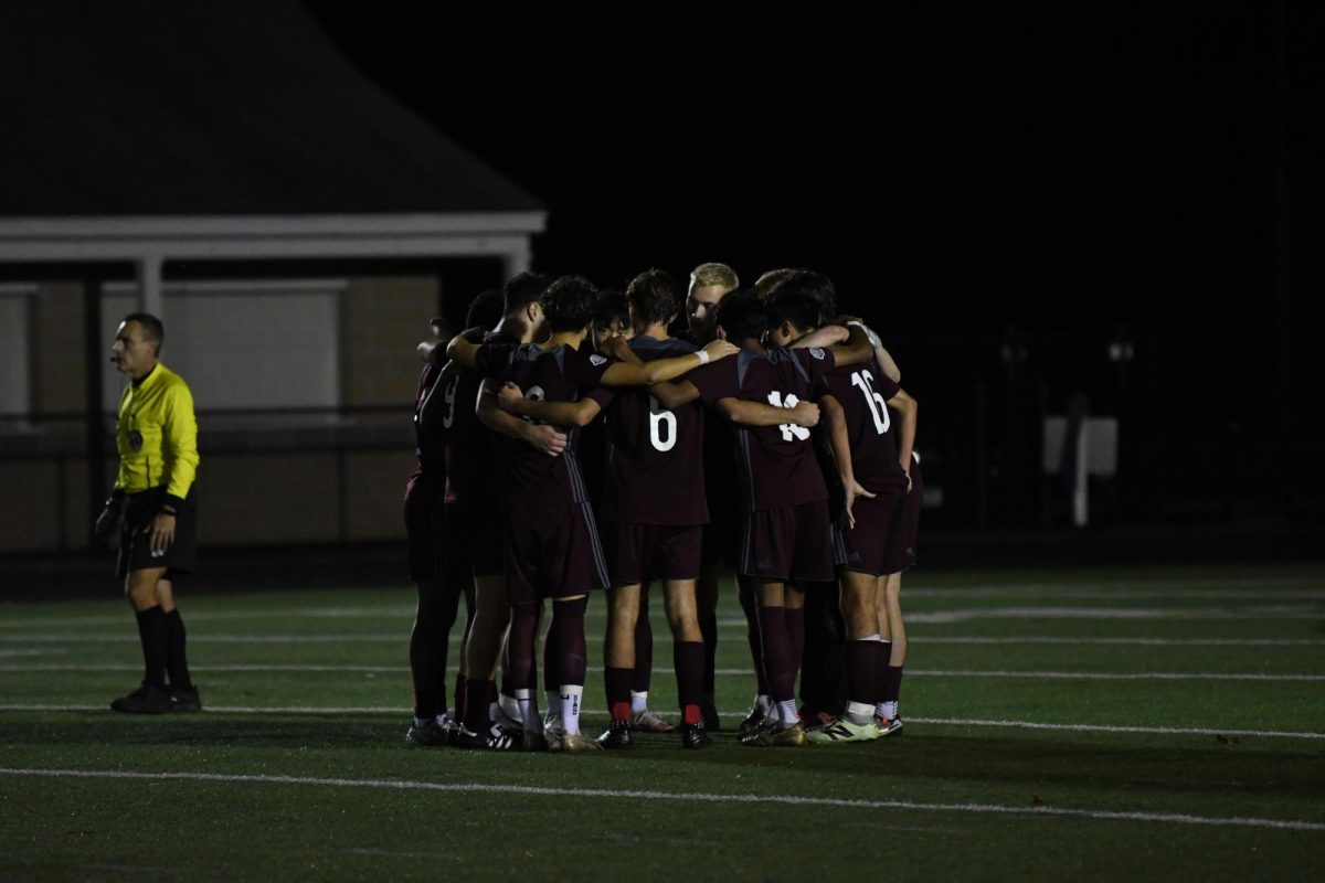 WA players get together for a pep talk before the first round of overtime.