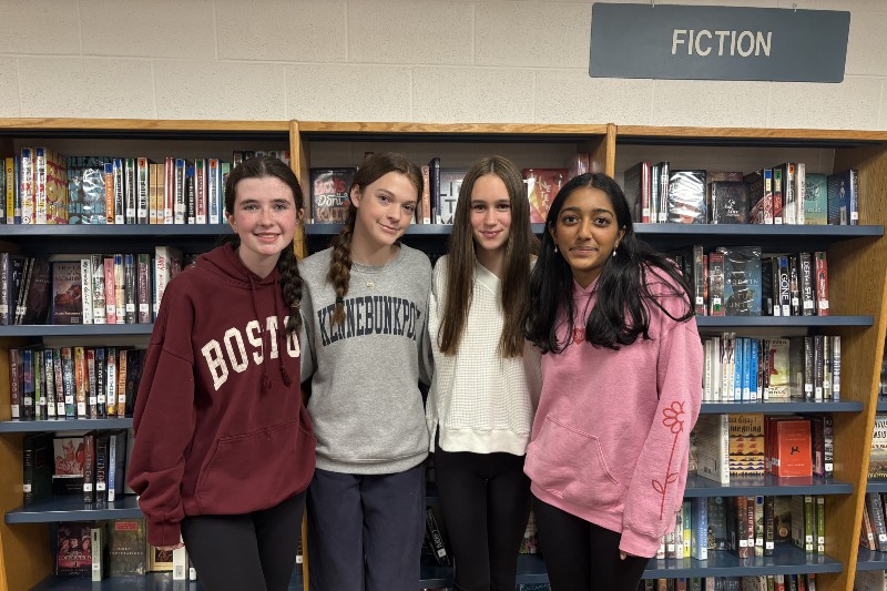 Books for Brighter Futures' founders, (from left to right) freshmen Rachel Newman, Clara Ganz, Brooke Ducharme, and Adhya Kottani pose for a picture in the library.