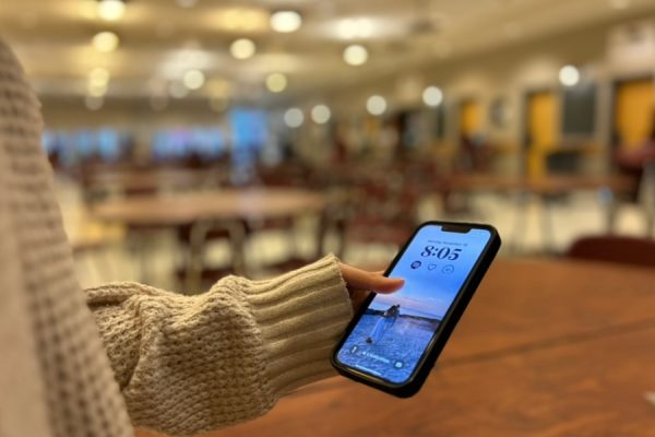 Students us their phones during DLT after the updated policy was instituted.