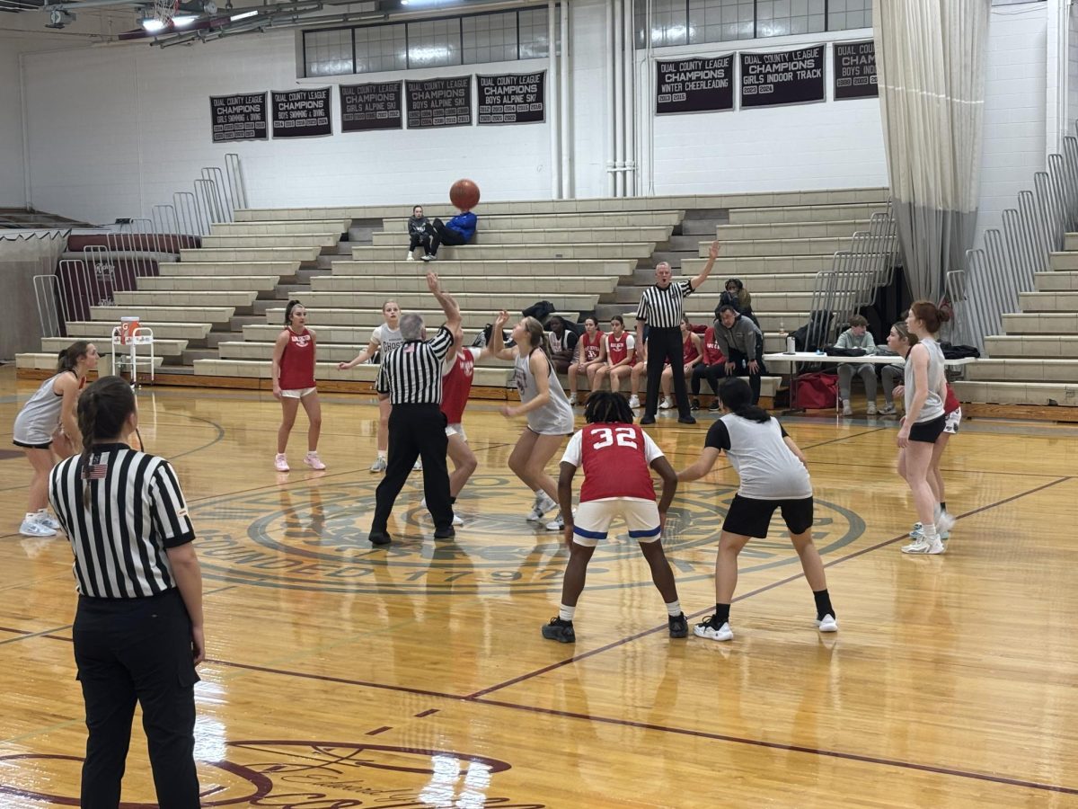 Junior Brooke Neilson prepares to take the jump ball for the scrimmage. 