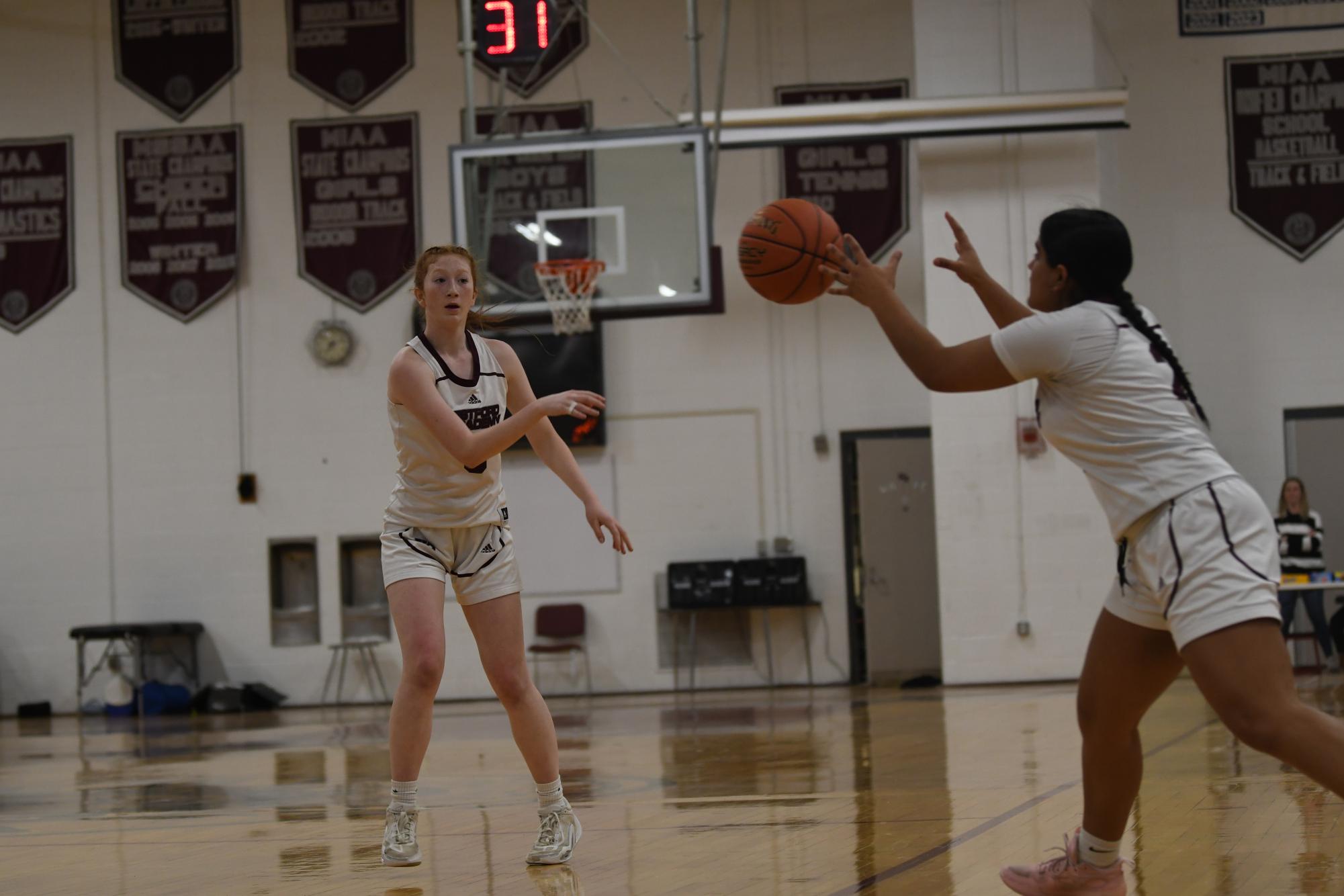 Coward passes the ball to senior Diya Jayaraman.