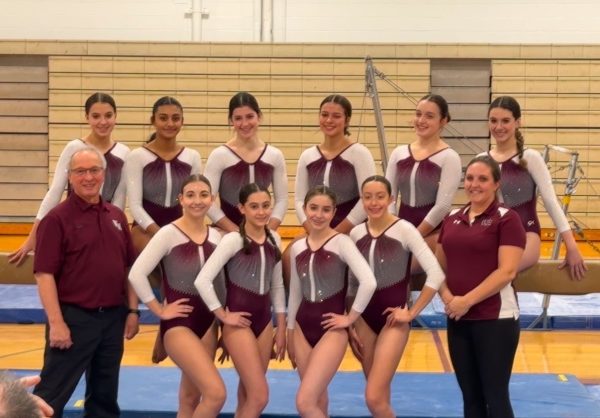 The WA gymnastics team poses for team picture. 