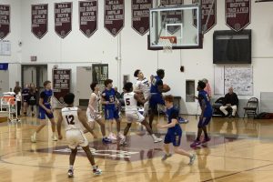 Senior captain Nate Pitts jumps to gain possession of the ball.