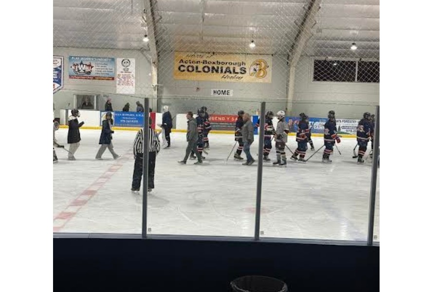 Both teams high-five after the game ends.