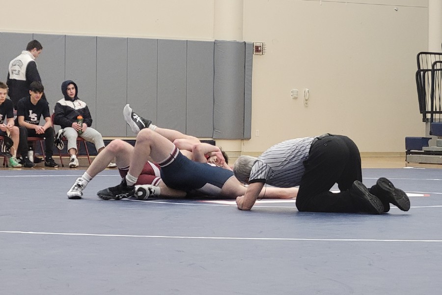 WA freshman Thomas Sears faces off against Doug Tamilio, pinning him to win the match.