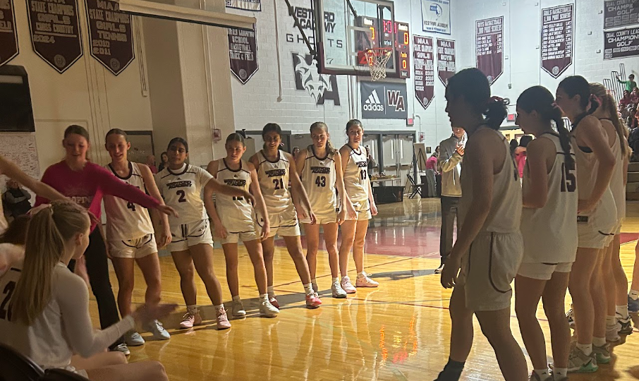 WA girls basketball lining up for the announcement of the starting line up