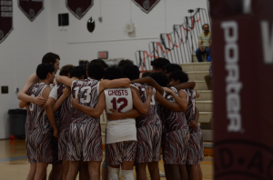 The team huddles before the game begins. 