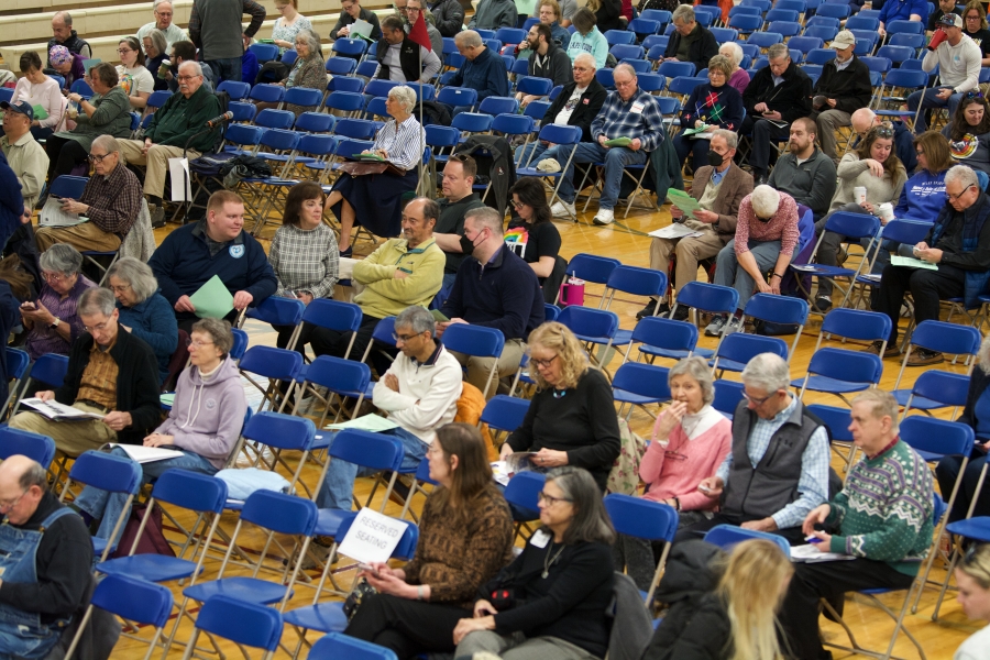 Westford voters settle into their seats before the 2025 Annual Town Meeting begins.