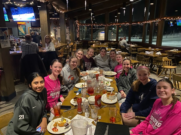 The girls' go out for a team dinner after their game. 