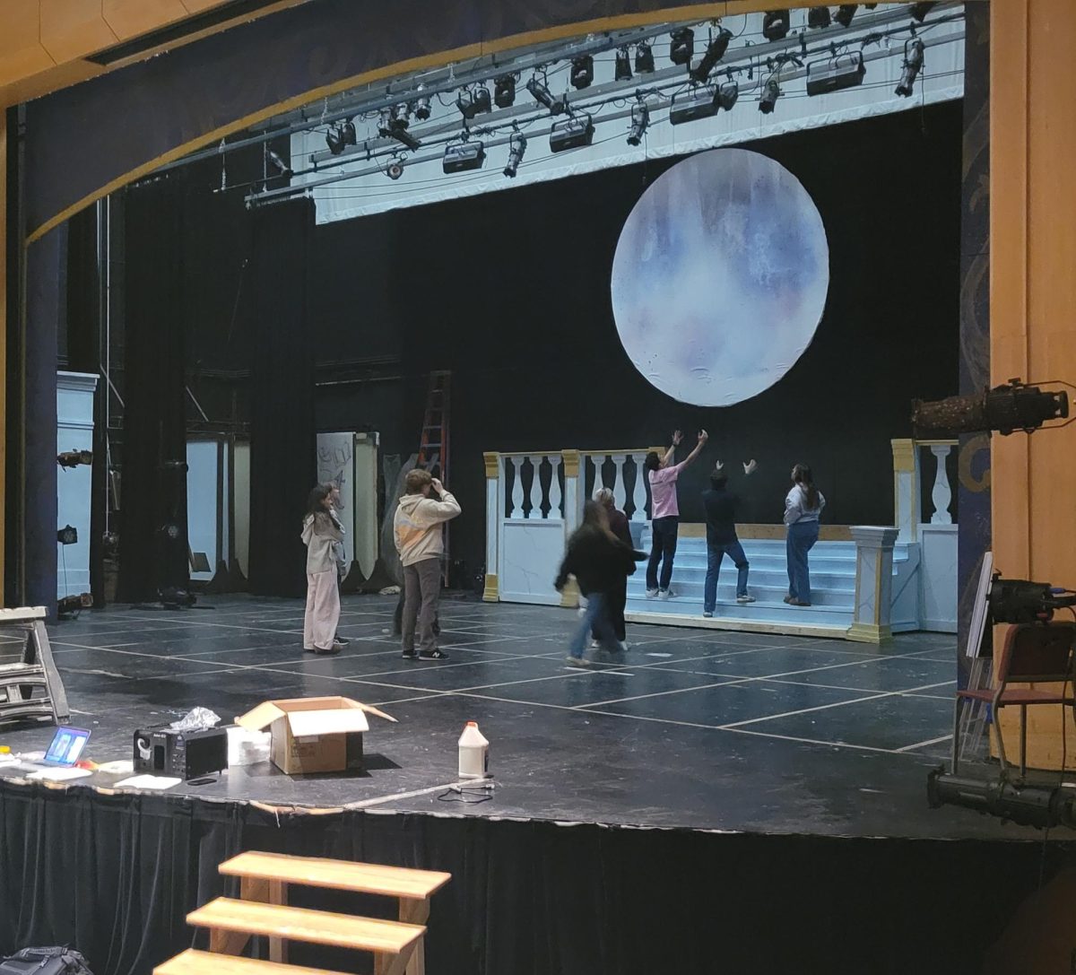 A blocking rehearsal is led upon unfinished concepts of a palace scene set.