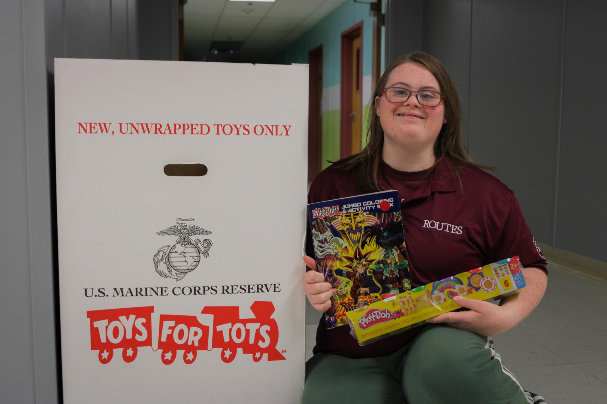 Norton poses with a few of the toys she's collected thus far.