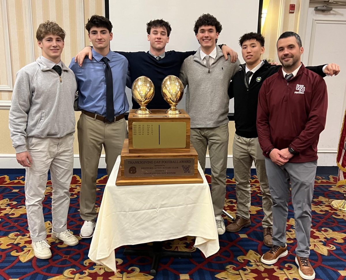 From left to right: junior captain Brett Moran, idk, idk, idk, senior captain Ben Chen, head coach Bruce Rich.