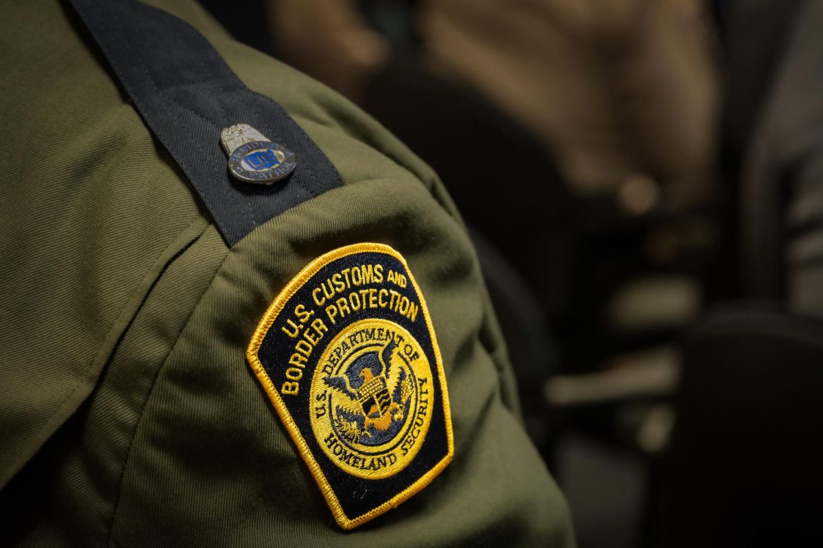 A U.S. Customs and Border Protection agent stands in uniform.