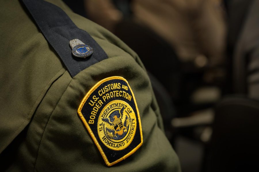 A U.S. Customs and Border Protection agent stands in uniform.