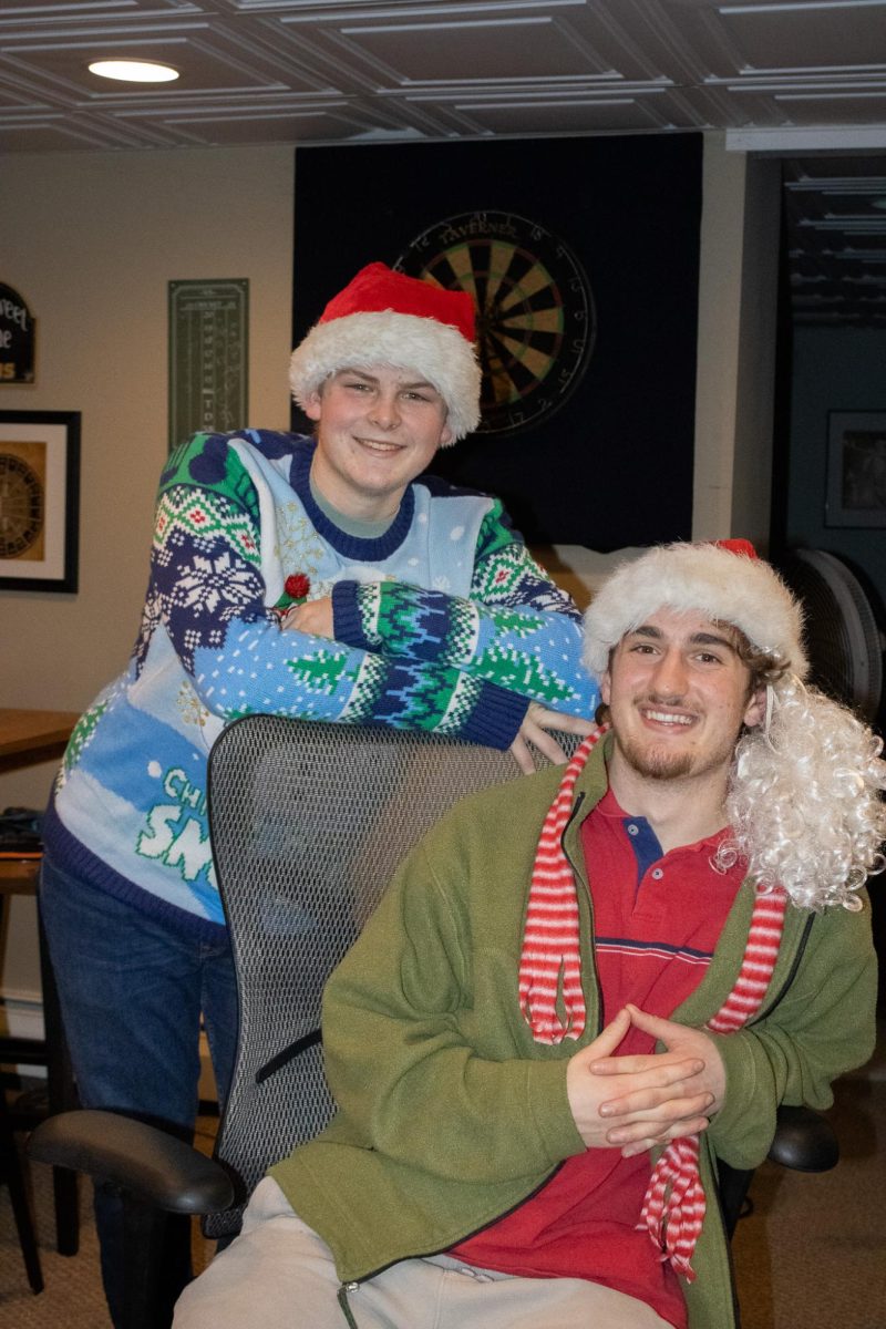 Dressed head to toe in Christmas spirit, the two artists smile for a final photo.
