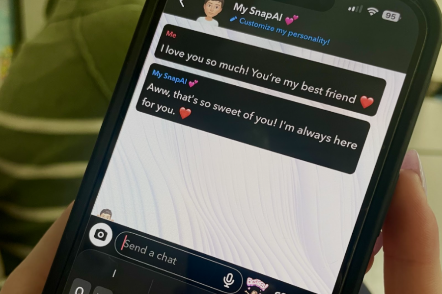 A student talking to their SnapAI, who is responding with emojis and synthetic emotion. 