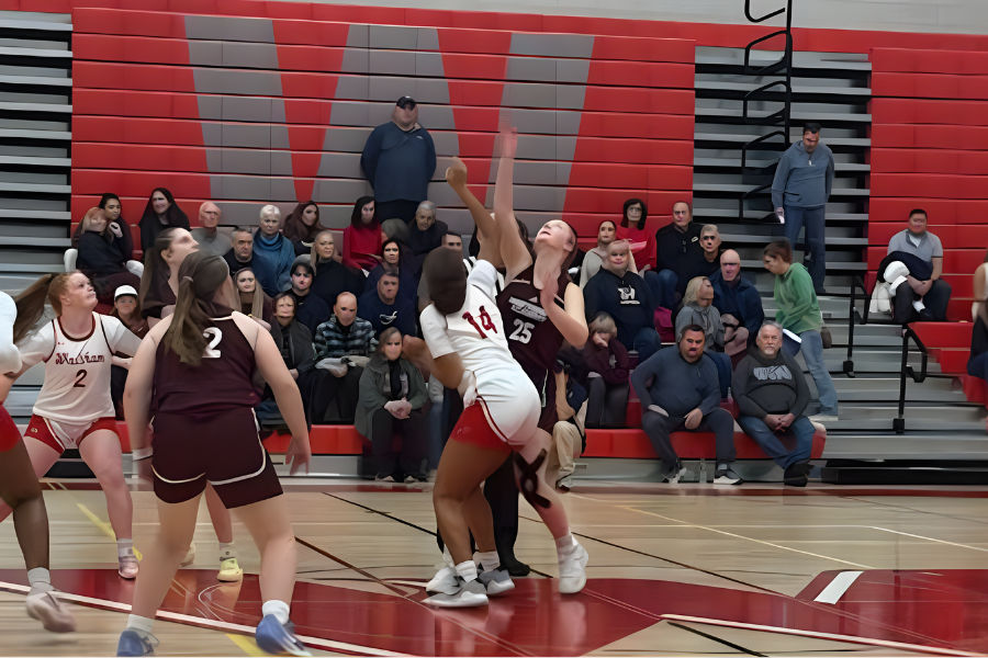 The games begins with a tip off as senior captain Kaitlyn Pepin reaches for the ball. 