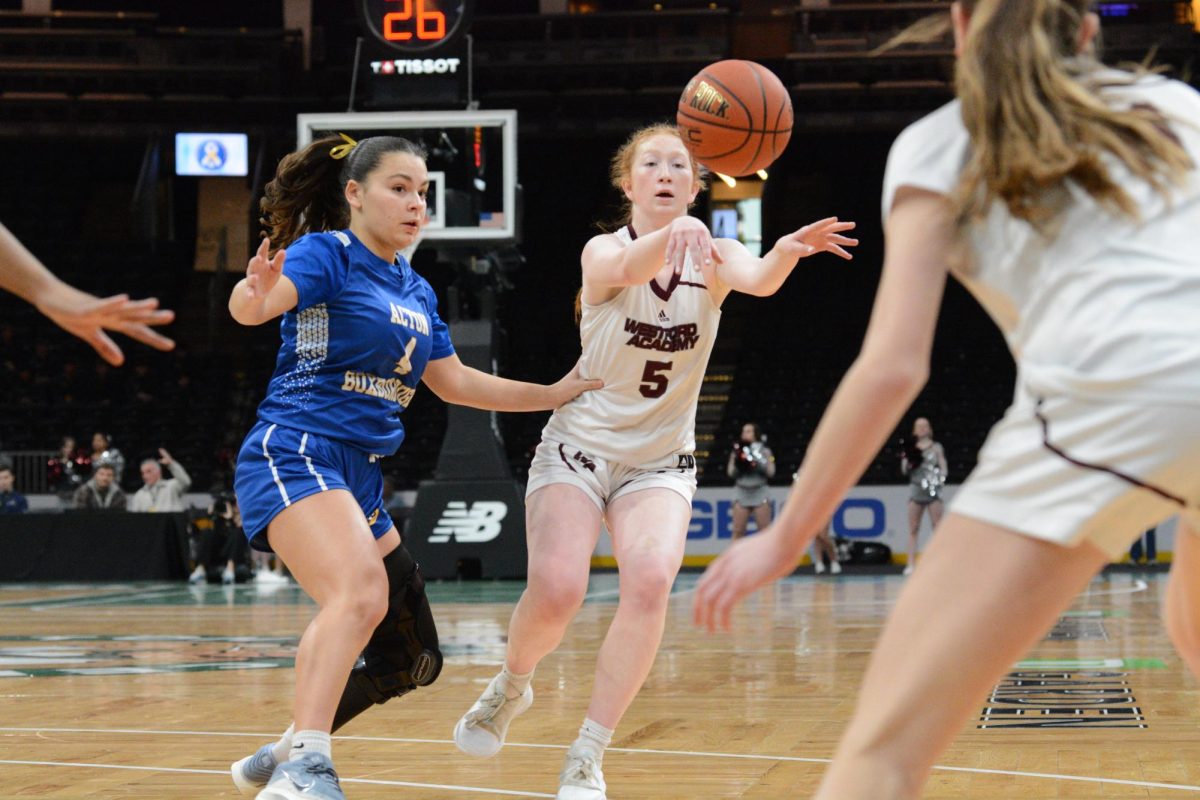 Junior Alexa Coward passes the ball to a teammate.