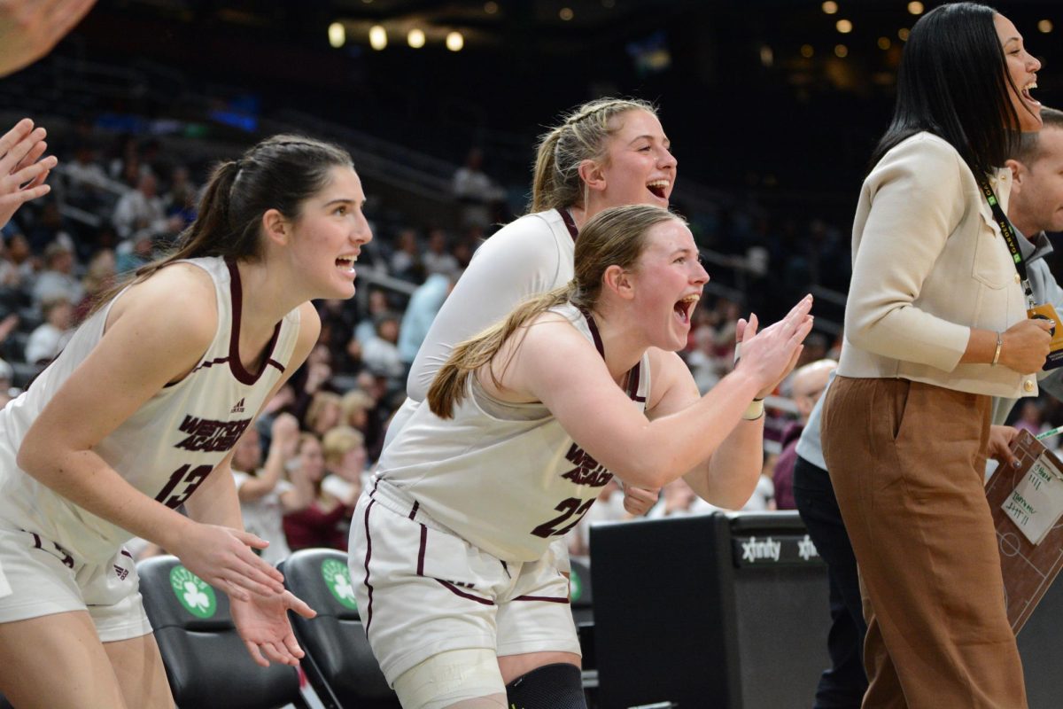 WA's bench erupts after an impressive play by Trahan, who went on a scoring streak in the second half.