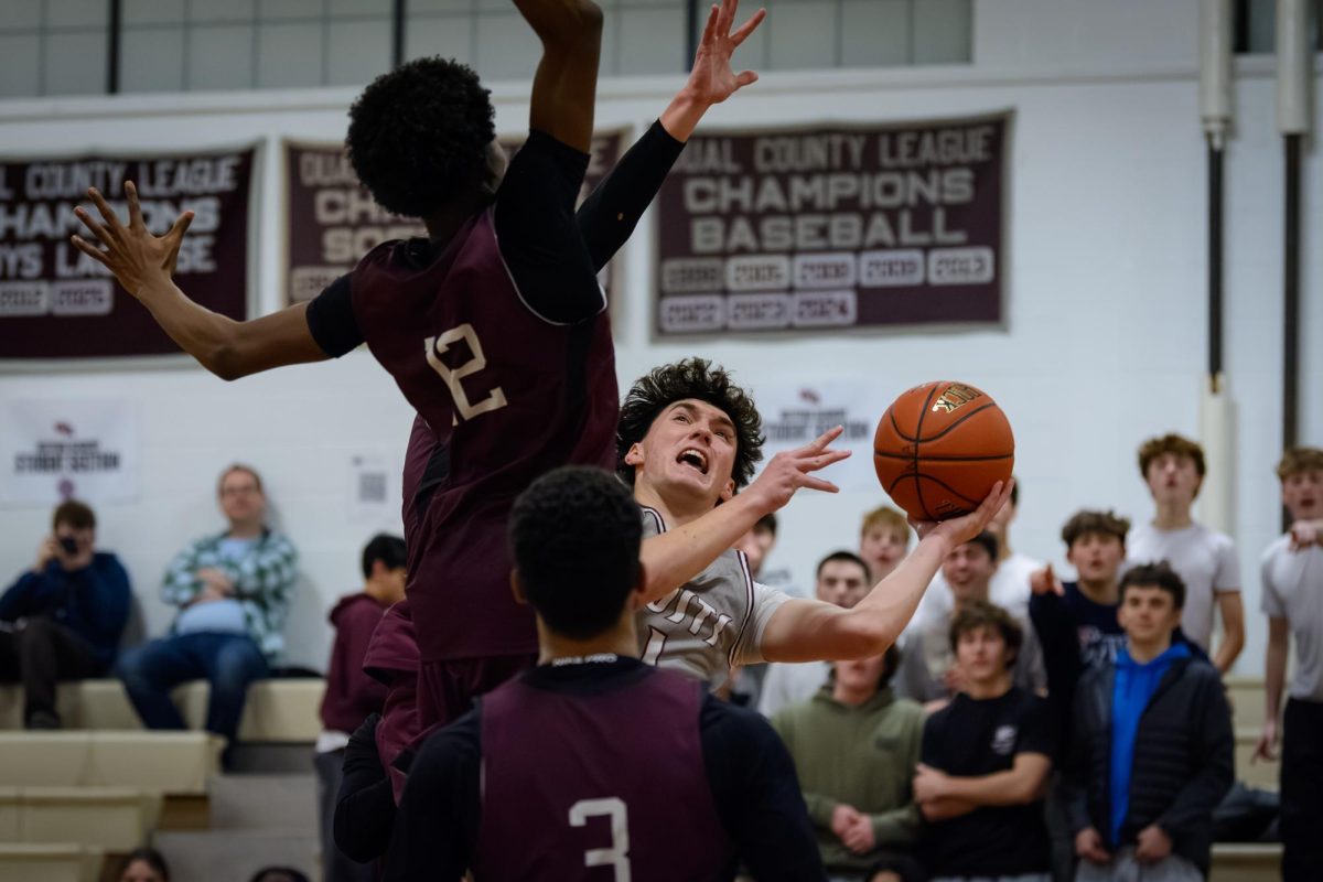 Hirbour tries to get a shot off while being fouled by a Weston player.