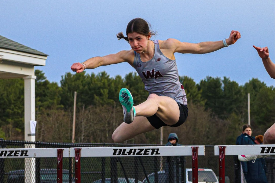 McDermott competes in the hurdles event during a meet at WA.