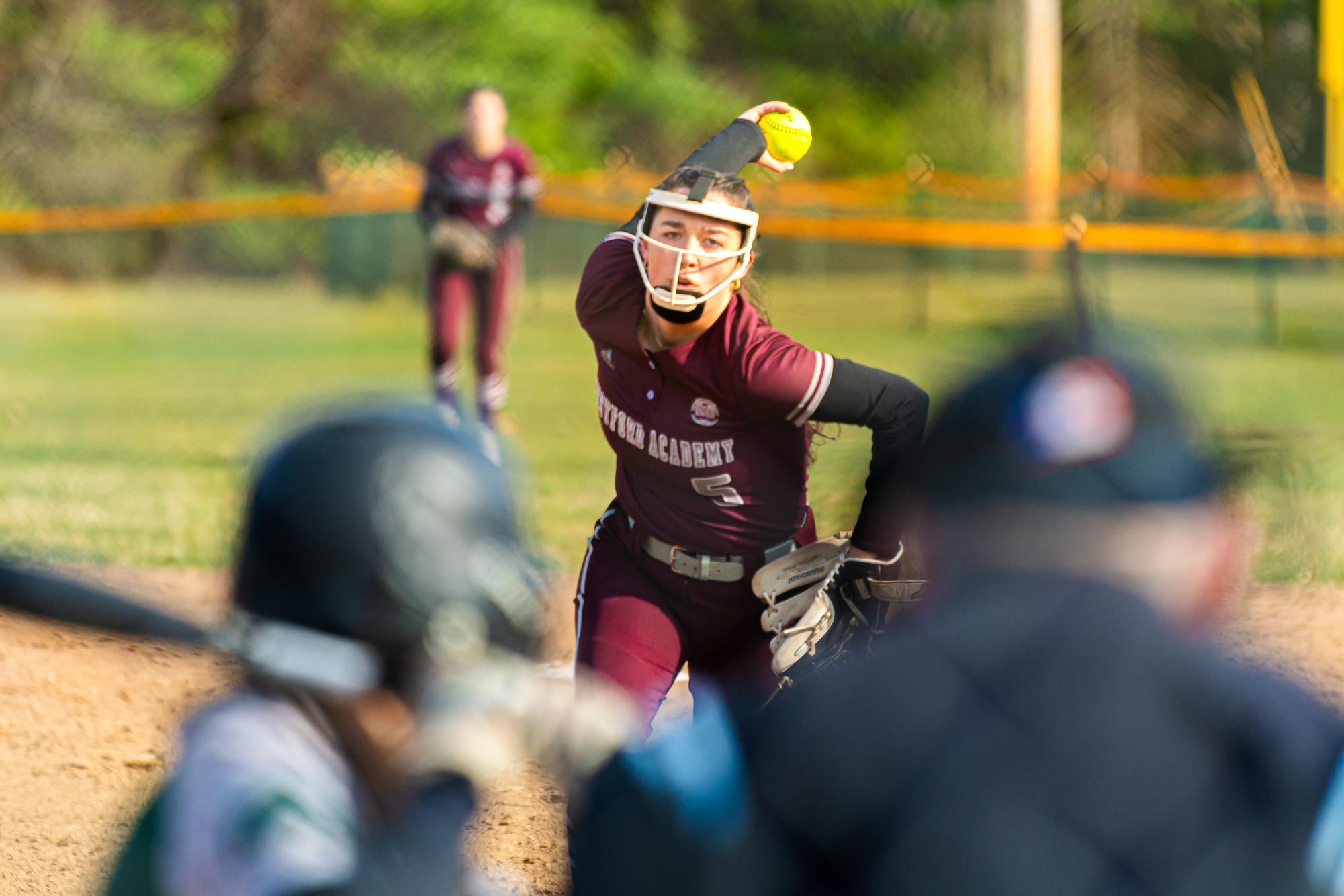 Senior captain Olivia Bernier swings her arm in preparation to pitch.