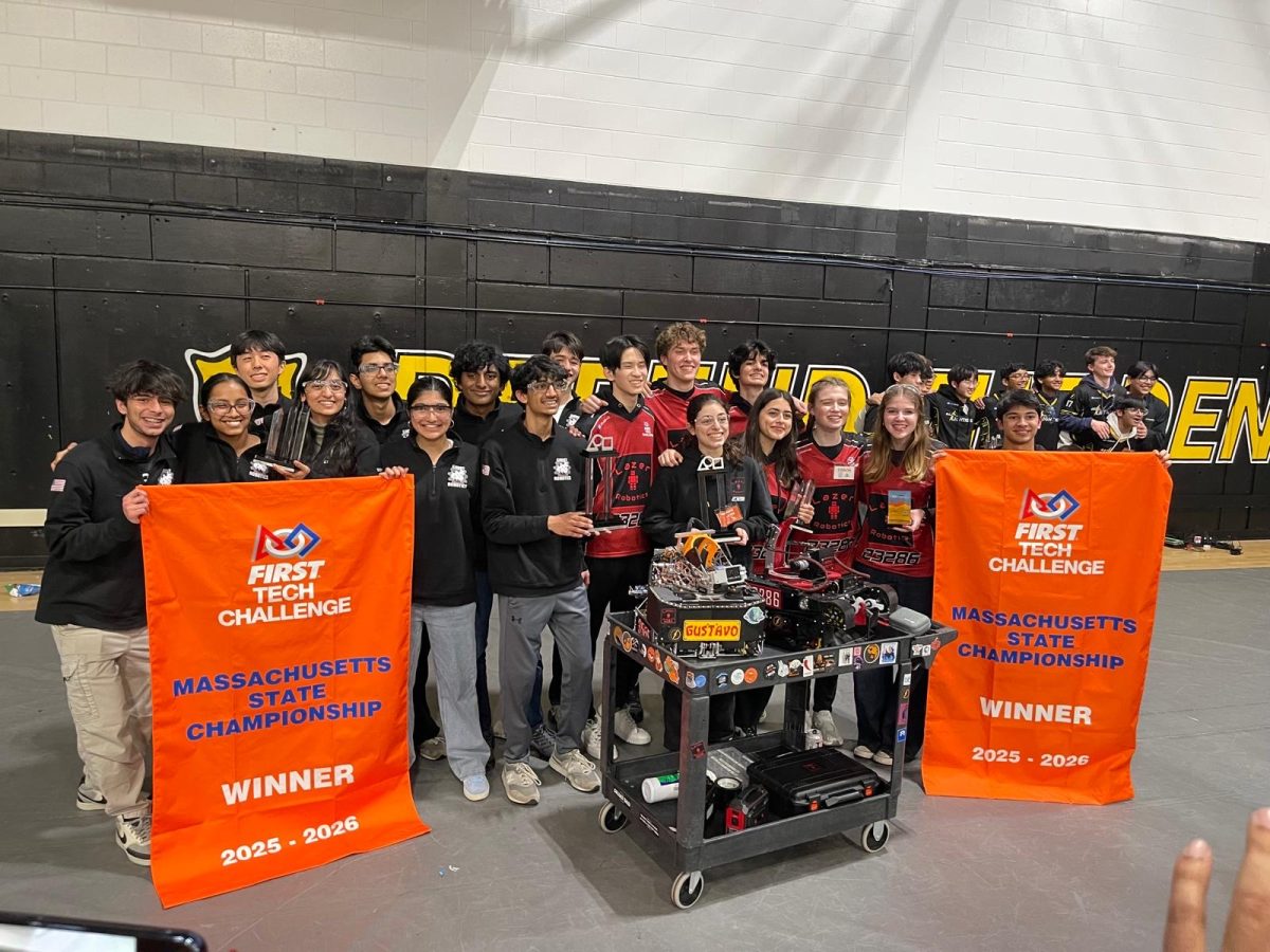 Ghosts Robotics posing with their banner after winning state competition.