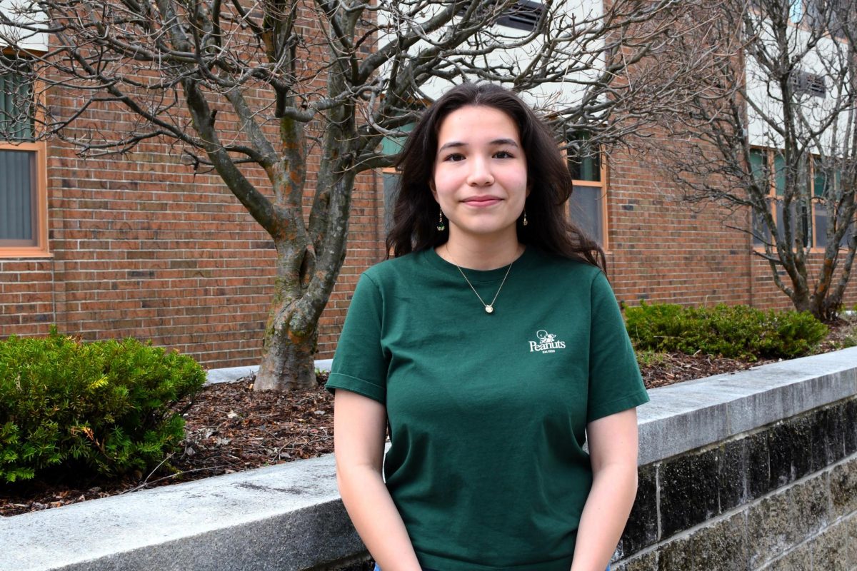 Gil Promlee poses for a photo outside of Westford Academy.