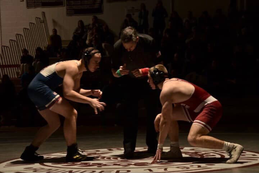Dulong crouches down, readying himself to begin the match.