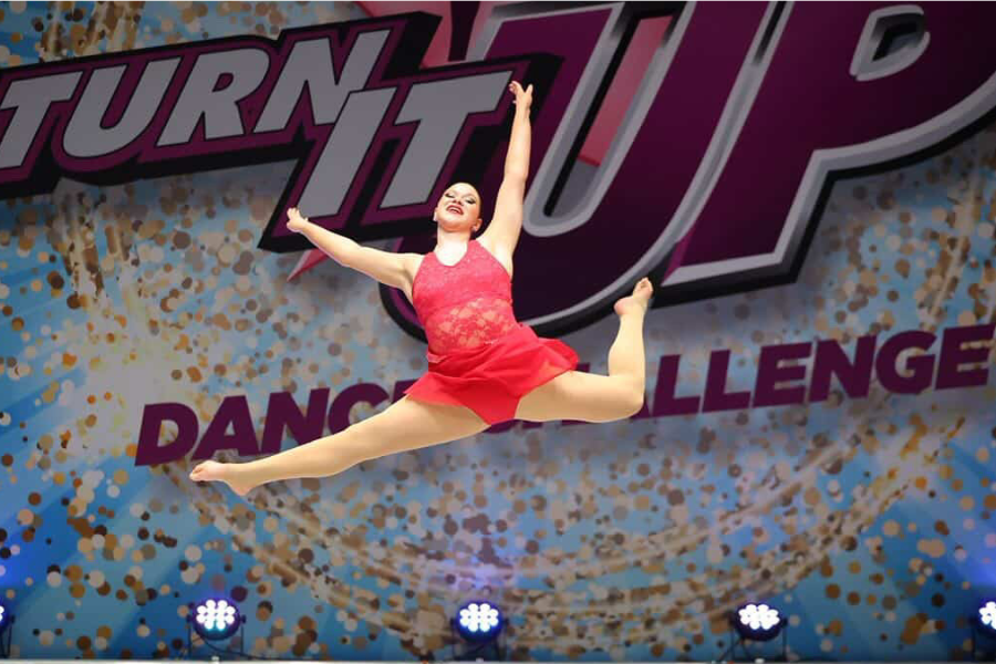 Cassie leaps while onstage during her solo.