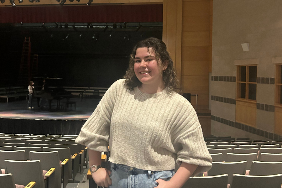  Murphy smiles for a photo against a backdrop of the Performing Arts Center (PAC), where she has spent countless hours performing and rehearsing. 
