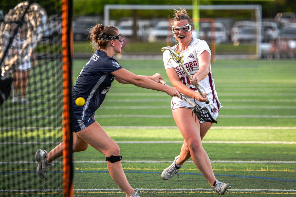 Williams whips the ball past a Framingham defender into the net.