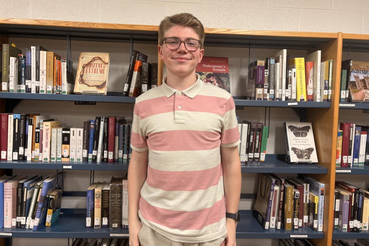 Dailey poses for a photo in the library.