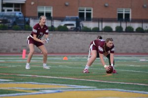 Smith and Brooke Nielsen crouch in the ready position, prepared to start their offensive play.